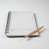 Game Night Journal opened to a score page with a pen on a white background
